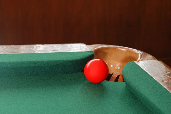 Red snooker ball by corner pocket — Stock Photo, Image