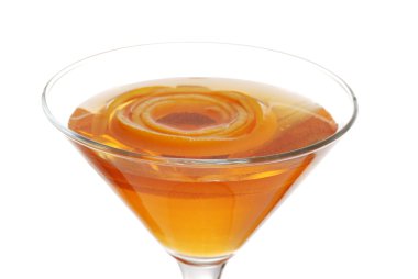 Sparkling orange martini with peel floating focus on rim clipart