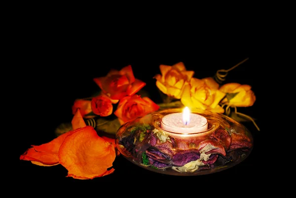 Růže a svíčka — Stock fotografie