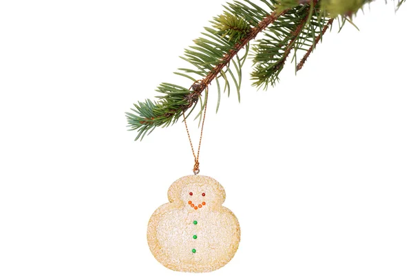 Snowman cookie hanging on christmas tree branch — Stock Photo, Image