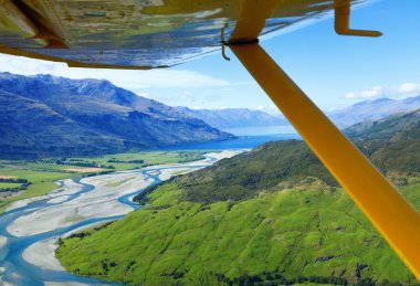 Flying over New Zealand clipart