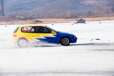 Car at the winter rally in russia clipart