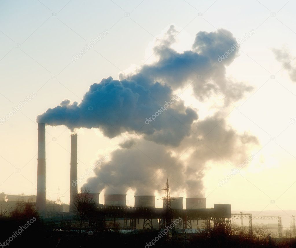 Industrial site with smoking pipes global warming concept