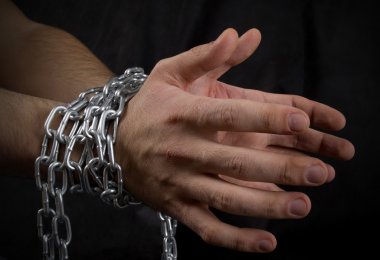 Photo of man's hands in chains clipart