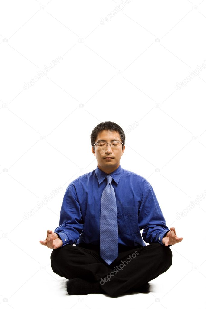 Meditating businessman