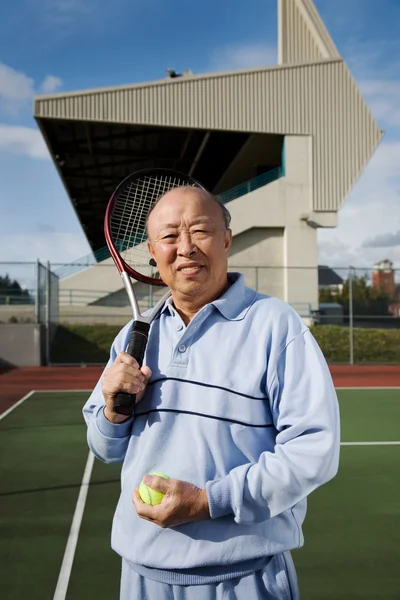 Jugador senior de tenis —  Fotos de Stock