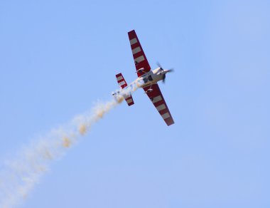 A jet plane at an air show clipart