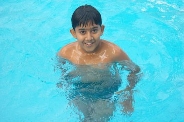 Boy in swimming pool clipart