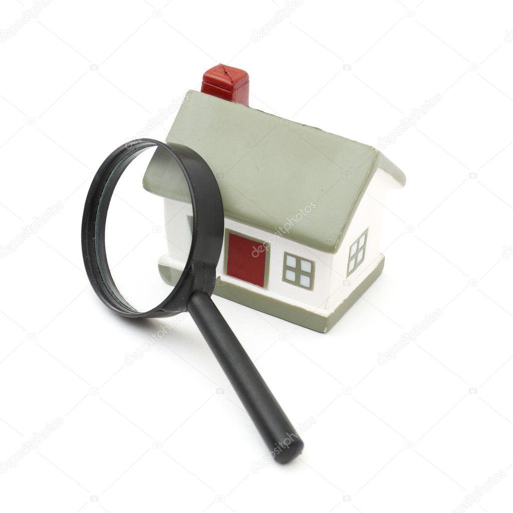 Magnifying glass examining model home — Stock Photo © merznatalia 4593267