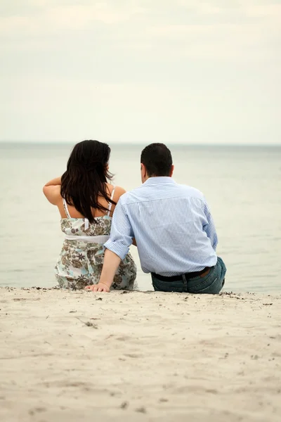 stock image Happy young couple having fun on the beach