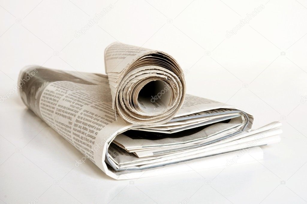 Pile of old newspaper on a white background