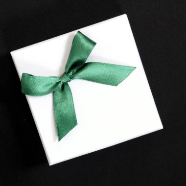 White gift with green ribbon clipart