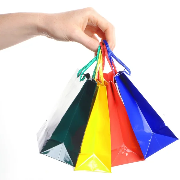 Carregando um monte de sacos de compras — Fotografia de Stock