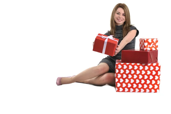 Chica joven atractiva con cajas de regalo — Foto de Stock