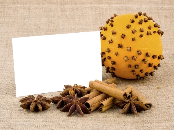 Christmas orange, spices and white note card — Stock Photo, Image