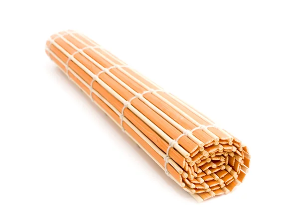 Рулонний помаранчевий бамбуковий килимок — стокове фото
