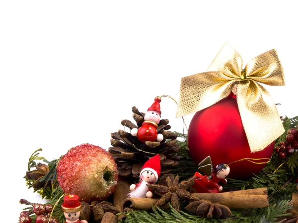 stock image Closeup picture of thuja branches, red glass ball, spices and small wooden figure on white background.