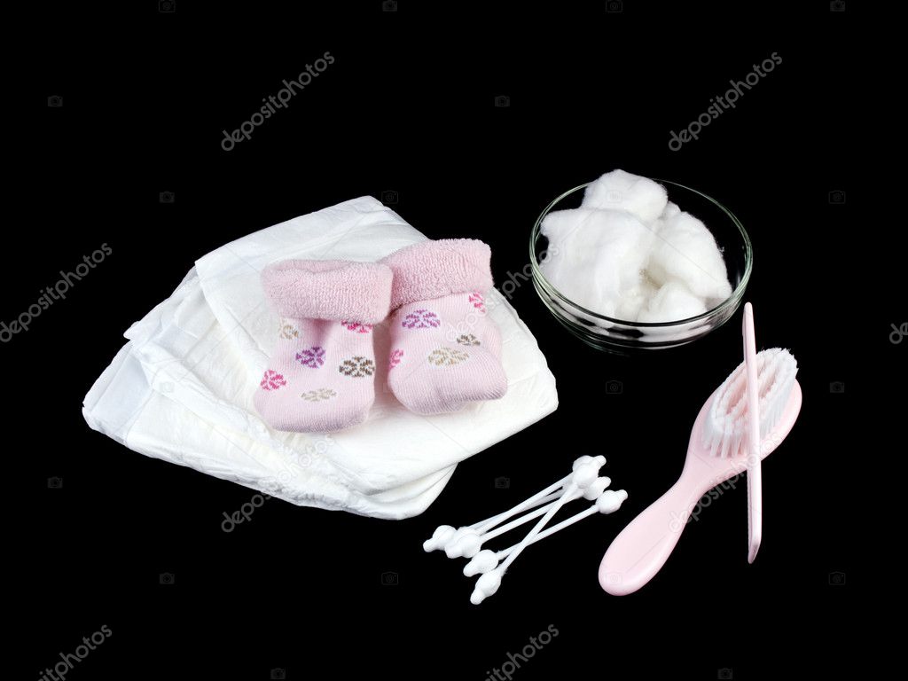 Newborn baby accessories on black background