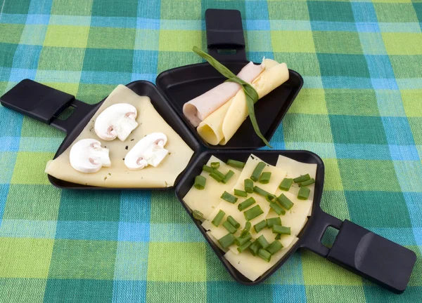 Three raclette pans — Stock Photo, Image
