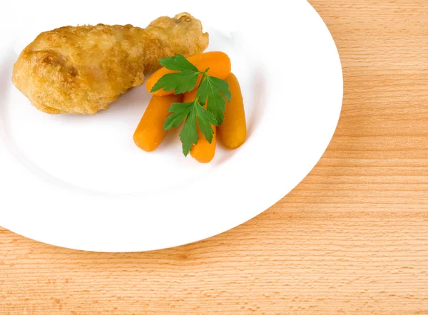 Fried chicken leg on white plate — Stock Photo, Image