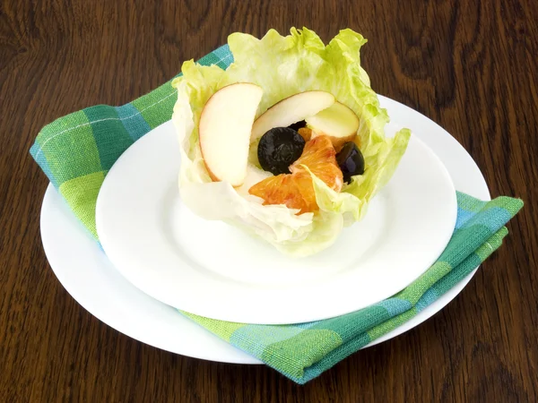 Fruit salad in lettuce leaf — Stock Photo, Image