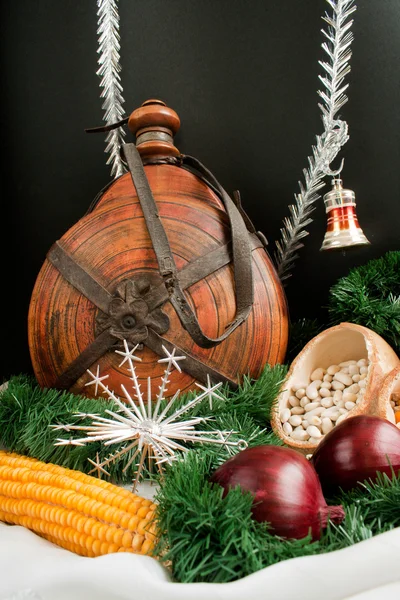 Christmas decoration with snowflakes, keg, garland, onion, corn — Stock Photo, Image