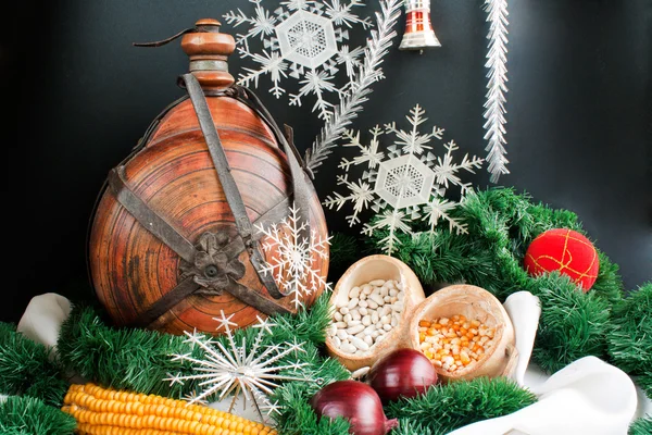 Christmas decoration with snowflakes, keg, garland, onion, corn — Stock Photo, Image
