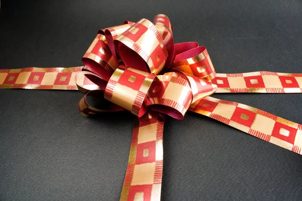 A red ribbon tied in a bow — Stock Photo, Image