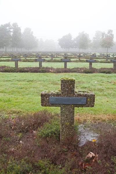 Crosses at cemetery in autumn mist — Stock Photo, Image