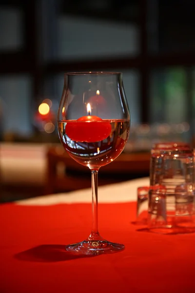 Glass for wine and candle. — Stock Photo, Image