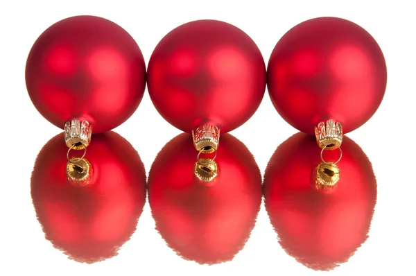 Üç kırmızı baubles — Stok fotoğraf
