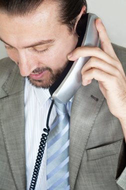 Businessmen talking on the phone clipart