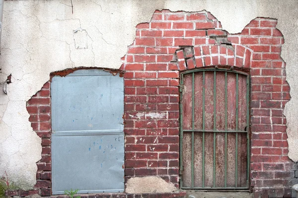 stock image Old wall with rusty doors