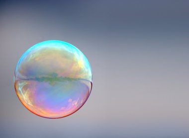 Soap bubble on gray background clipart