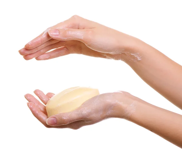 Mãos femininas em sabonetes isolados em branco — Fotografia de Stock
