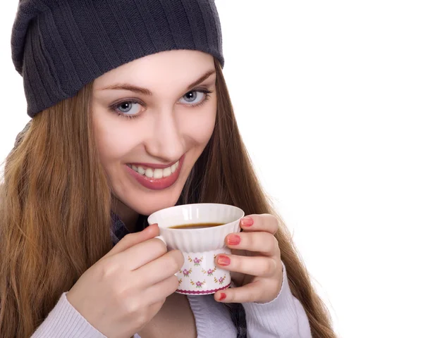 Happy young woman with cup of coffee on a white background — Stock Photo, Image