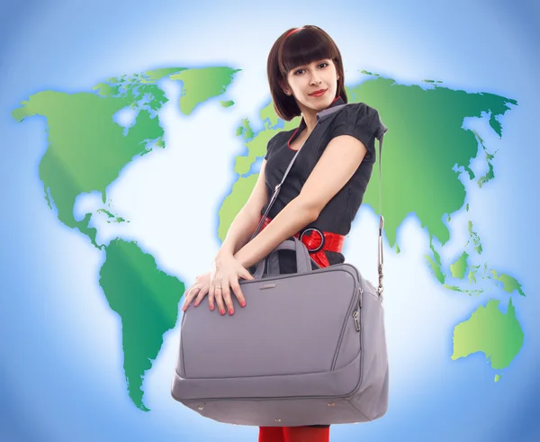Stijlvolle jongedame reizen op wereld kaart achtergrond — Stockfoto