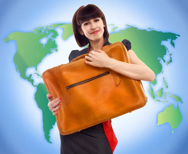 Jonge toeristische vrouw met bagage op wereld kaart achtergrond — Stockfoto