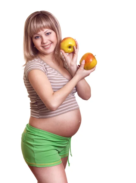 白で隔離される手でアップルと妊娠中の女性の肖像画 — ストック写真