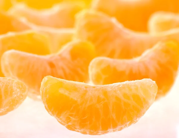 stock image Slices of peeled orange blur background