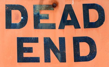 A Dirty, Grungy, Orange Dead End Sign clipart