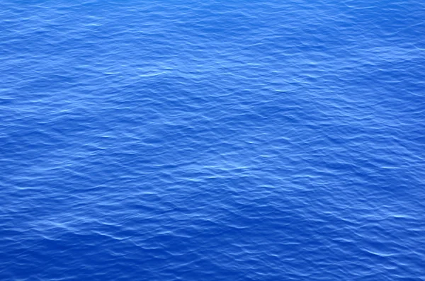 Textura pozadí klidný oceán vody — Stock fotografie