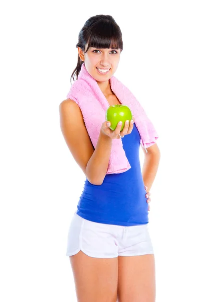 Młoda kobieta z zielonym jabłkiem w dłoni po fitness. — Zdjęcie stockowe