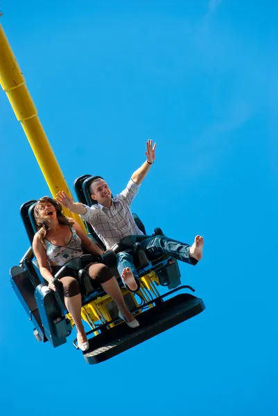 Happy Young Couple Riding Attraction — Stock Photo, Image