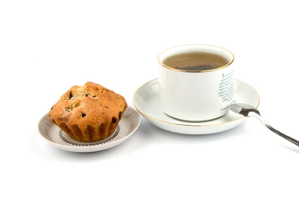 Stock image Cup of tea and cake on the saucer