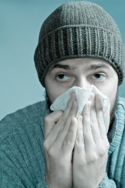 Portrait of sore man infected with flu virus clipart