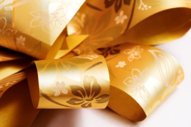 Extreme closeup on golden festive ribbon clipart