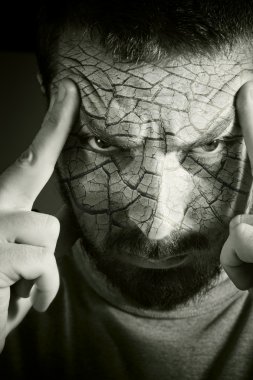 Upset man with cracked skin clipart