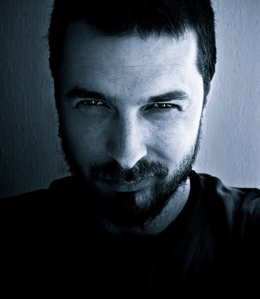 Portrait of dangerous and interesting looking man