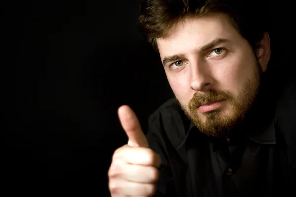 Confident man showing thumb up — Stock Photo, Image